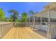 Exterior view of the home deck and patio with a view of the yard and trees at 3394 Hawkin Dr, Kissimmee, FL 34746