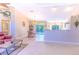 The dining area is brightly lit and features tile floors, chandelier, and views of the pool at 3394 Hawkin Dr, Kissimmee, FL 34746