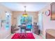 Bright dining area with tile flooring, natural light, and a view of the pool at 3394 Hawkin Dr, Kissimmee, FL 34746