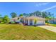 Charming single-story home with well-maintained lawn and landscaping plus an attached two car garage at 3394 Hawkin Dr, Kissimmee, FL 34746