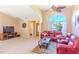 Inviting living room with carpeted floors, natural light, and a ceiling fan at 3394 Hawkin Dr, Kissimmee, FL 34746