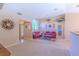 A bright, open-concept living room with view of front door, decor and views of other rooms at 3394 Hawkin Dr, Kissimmee, FL 34746
