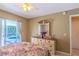 Comfortable main bedroom featuring a ceiling fan and sliding door access to the pool at 3394 Hawkin Dr, Kissimmee, FL 34746