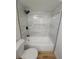 Modern bathroom featuring sleek white tiles, a black shower head, and a new bathtub at 3504 Portersfield Rd, Orlando, FL 32808