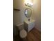 Cozy bathroom featuring a modern vanity, framed mirror and toilet at 3504 Portersfield Rd, Orlando, FL 32808