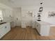 Bright kitchen featuring white cabinets, quartz countertops, and stainless sink at 3504 Portersfield Rd, Orlando, FL 32808