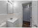 This bathroom offers a vanity, sink, mirror, and a view of the doorway at 4121 Caywood Cir, Orlando, FL 32810