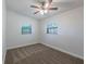 Bedroom featuring neutral colored carpet and bright windows at 4121 Caywood Cir, Orlando, FL 32810