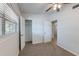 This carpeted bedroom offers a window, closet, and entrance to the hallway at 4121 Caywood Cir, Orlando, FL 32810