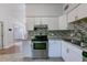 Kitchen featuring stainless appliances, granite counters and tiled backsplash at 4121 Caywood Cir, Orlando, FL 32810