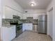 Kitchen featuring stainless appliances, granite counters and tiled backsplash at 4121 Caywood Cir, Orlando, FL 32810