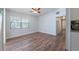 Bright living room with wood-look floors and a ceiling fan at 4121 Caywood Cir, Orlando, FL 32810