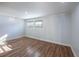 Bright room featuring wood-look flooring, neutral walls, and natural lighting at 4121 Caywood Cir, Orlando, FL 32810