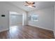 Bright room featuring wood-look flooring, neutral walls, and natural lighting at 4121 Caywood Cir, Orlando, FL 32810