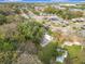 Aerial view of a residential neighborhood featuring a lake and surrounding trees at 444 Sunnyview Cir, Orlando, FL 32810