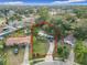 Aerial view of the property showcasing its layout, landscaping, and neighborhood surroundings, with a nearby pool at 444 Sunnyview Cir, Orlando, FL 32810