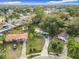 Aerial view of the property showcasing its layout, landscaping, and neighborhood surroundings, with a nearby pool at 444 Sunnyview Cir, Orlando, FL 32810