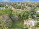 Drone image showing an expansive, wooded lot offering privacy in a quiet neighborhood at 444 Sunnyview Cir, Orlando, FL 32810