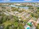 Aerial view of a residential neighborhood with a lake and city buildings in the distance at 444 Sunnyview Cir, Orlando, FL 32810
