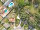 Aerial view of a property surrounded by lush greenery in a residential neighborhood at 444 Sunnyview Cir, Orlando, FL 32810