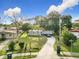 Aerial view showcasing the home, landscaping, and surrounding neighborhood at 444 Sunnyview Cir, Orlando, FL 32810