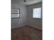 Comfortable bedroom featuring laminated floor, natural light at 444 Sunnyview Cir, Orlando, FL 32810