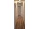 Hallway boasting new laminated floors and fresh paint at 444 Sunnyview Cir, Orlando, FL 32810