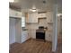 Bright kitchen with stainless steel appliances, white cabinets, and modern countertops at 444 Sunnyview Cir, Orlando, FL 32810