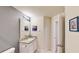 Stylish bathroom featuring granite countertops, contemporary lighting, and a large mirror at 4512 Sparkling Shell Ave, Kissimmee, FL 34746