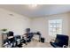 Comfortable bedroom featuring a work space with a computer and plenty of natural light at 4512 Sparkling Shell Ave, Kissimmee, FL 34746