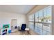 Bedroom with light walls, light carpet, a comfortable chair and a bright window at 4512 Sparkling Shell Ave, Kissimmee, FL 34746