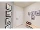 Entryway displaying art decor, neutral walls, a white front door, and a tiled floor at 4512 Sparkling Shell Ave, Kissimmee, FL 34746
