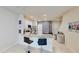 Eat-in kitchen featuring a stone countertop bar, stainless steel appliances, and tile flooring at 4512 Sparkling Shell Ave, Kissimmee, FL 34746