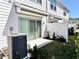Cozy back patio with sliding glass doors and a small fenced yard at 4512 Sparkling Shell Ave, Kissimmee, FL 34746