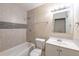 Well-lit bathroom with tub and shower and modern-style vanity at 5206 Cortez Dr, Orlando, FL 32808