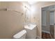 Bathroom featuring white cabinet sink with tiled backsplash and toilet at 5206 Cortez Dr, Orlando, FL 32808