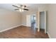 Bedroom showing flooring, ceiling fan, closet, and doorway to another room at 5206 Cortez Dr, Orlando, FL 32808