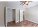 Bright bedroom with wood-look flooring and closet at 5206 Cortez Dr, Orlando, FL 32808