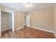 Neutral bedroom boasting hard wood floors, closet and an entry way at 5206 Cortez Dr, Orlando, FL 32808