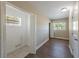 Room featuring tile flooring, two windows, and a closet at 5206 Cortez Dr, Orlando, FL 32808