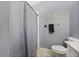 Neutral toned bathroom with a shower behind a curtain, a towel bar, and decor at 536 Southern Charm Dr, Orlando, FL 32807