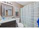 This bathroom features a vanity, toilet, and a shower/tub combo behind a curtain at 536 Southern Charm Dr, Orlando, FL 32807
