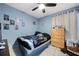 Cozy bedroom with fun décor, a ceiling fan, and great natural light for a comfortable space at 536 Southern Charm Dr, Orlando, FL 32807