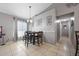 The dining area features tile floors, neutral paint, decorative wall accents, and a table with chairs at 536 Southern Charm Dr, Orlando, FL 32807