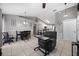 The open kitchen features tile floors, neutral paint, white cabinets, a kitchen island and stainless steel appliances at 536 Southern Charm Dr, Orlando, FL 32807