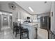 Bright kitchen features white cabinetry, stainless steel appliances, and a large island with seating at 536 Southern Charm Dr, Orlando, FL 32807