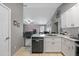Updated kitchen features granite countertops, stainless steel appliances, and ample storage at 536 Southern Charm Dr, Orlando, FL 32807