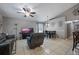The open living room features tile floors, a ceiling fan, and neutral paint, creating a cozy and inviting space at 536 Southern Charm Dr, Orlando, FL 32807