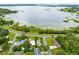 Scenic aerial view of a charming neighborhood nestled alongside a beautiful lake at 6305 Bass Hwy, St Cloud, FL 34771