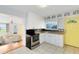 Cozy kitchen with stainless steel appliances and a view into the living room at 6305 Bass Hwy, St Cloud, FL 34771